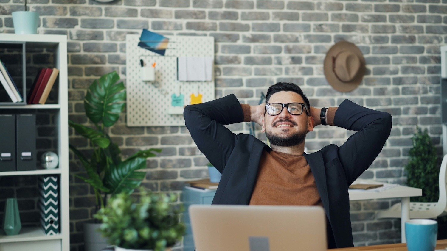 Office worker taking a mindful break to reduce stress at their desk